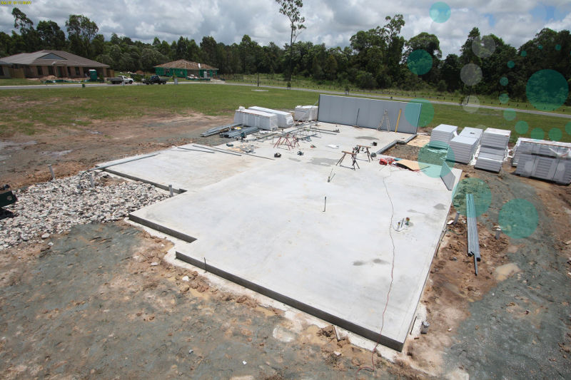 Start of construction with slab laid.  1st wall erected.